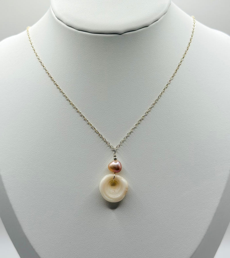 Hawaiian Puka Shell paired with pink fresh water Pearl