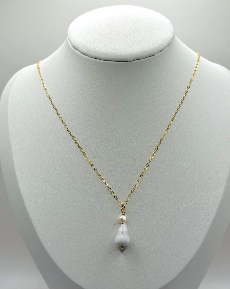 Cone Shell paired with fresh water Pearl