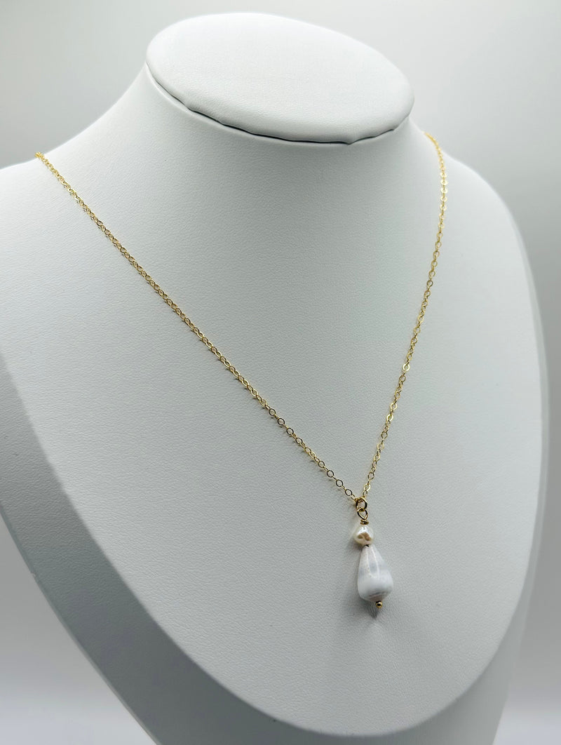 Cone Shell paired with fresh water Pearl