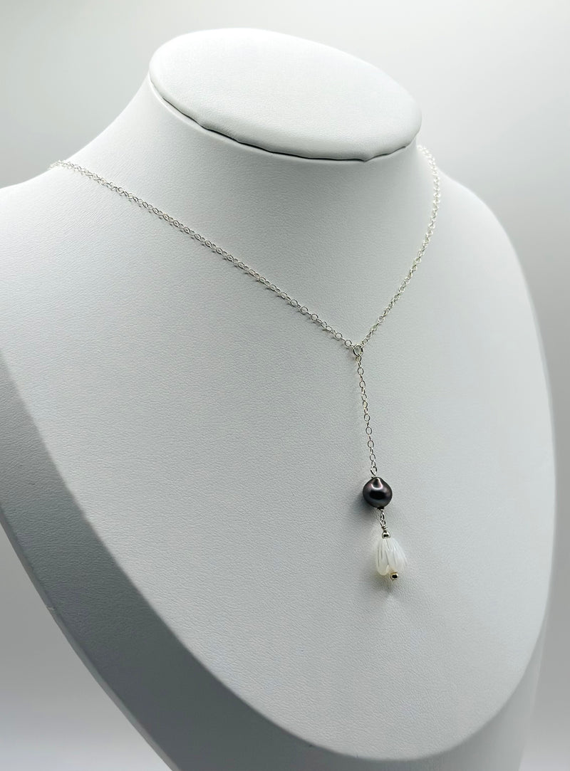 Black Tahitian Pearl features with a mother of Pearl into a Pikake flower (silver)
